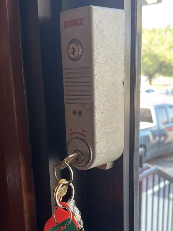 Keyed exit alarm lock on a business door